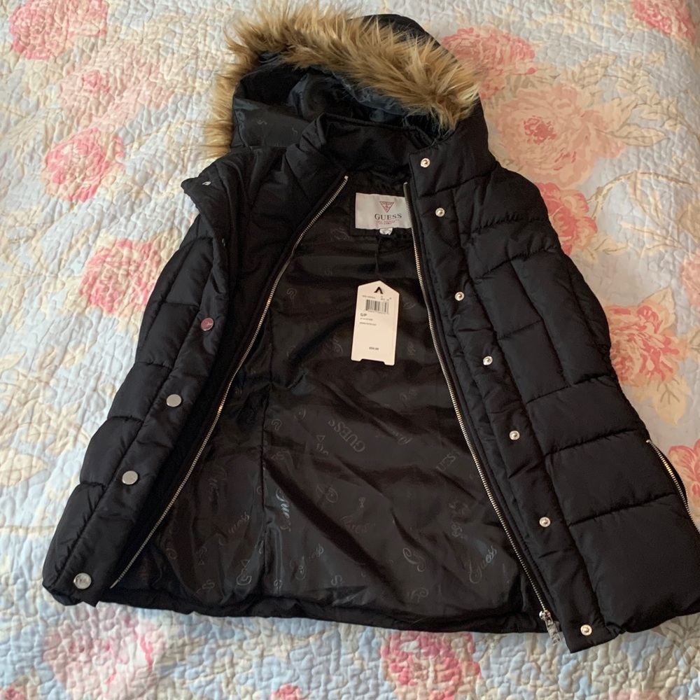 Black puffer vest with faux fur trimmed hood